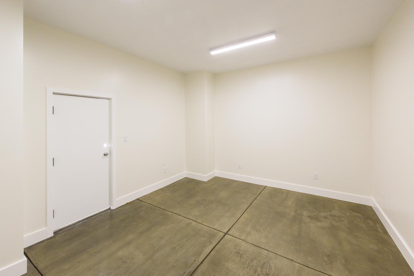  Bonus Room. Additional 200 sq. ft. with separate steel security door • Ethernet networked & electrical outlets • Stained concrete floor 